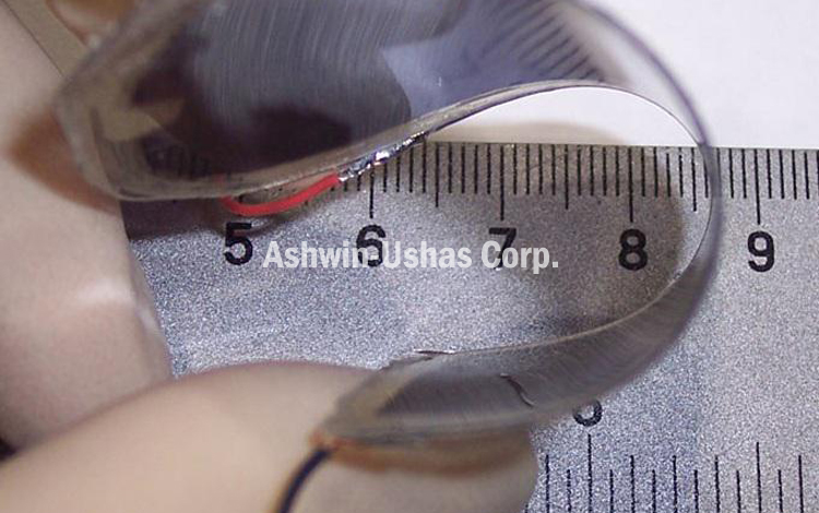 Example of exceptional flexibility, durability and thinness of electrochromic lens.